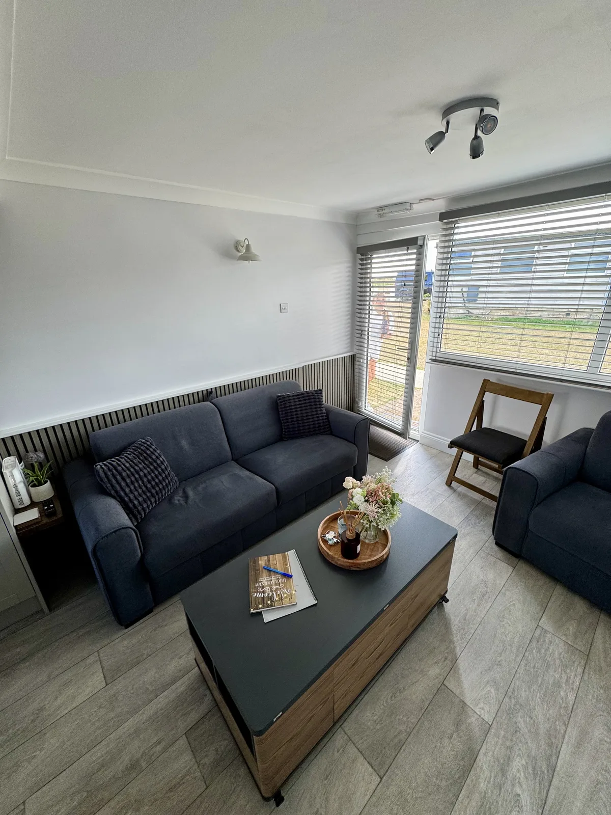 Yaverland Breeze living room showing the sofa, armchair and glass entrance door